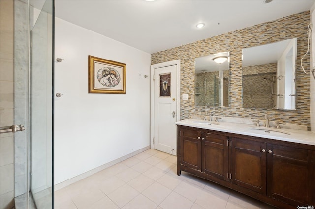 bathroom with tile patterned flooring, vanity, and an enclosed shower