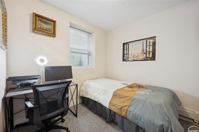 carpeted bedroom featuring baseboard heating