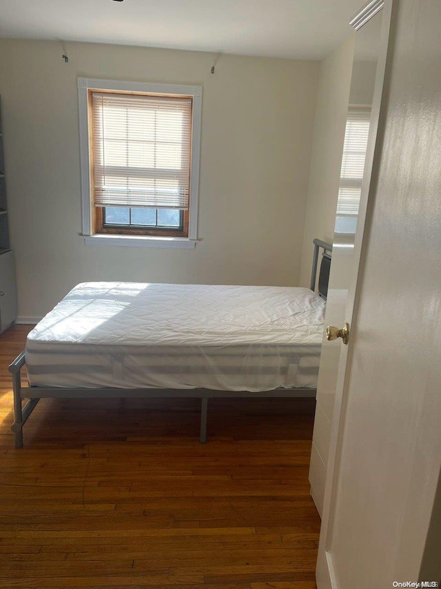 bedroom featuring dark hardwood / wood-style floors