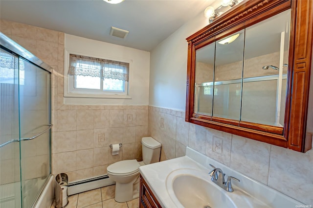 full bathroom with vanity, tile patterned floors, toilet, tile walls, and a baseboard radiator