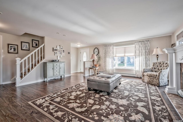 1 Jetmore Pl, Massapequa, NY 11758 - living area with stairway, wood finished floors, a baseboard heating unit, and a fireplace