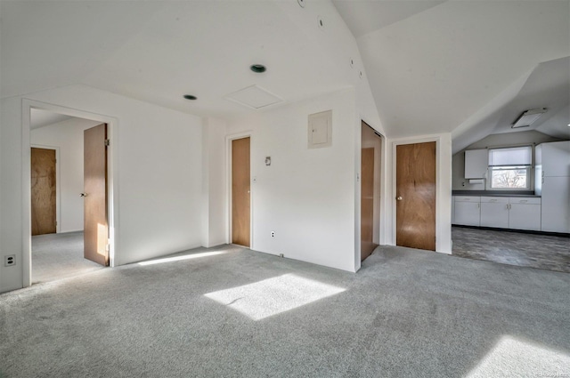 1 Jetmore Pl, Massapequa, NY 11758 - unfurnished bedroom featuring vaulted ceiling, carpet, electric panel, and connected bathroom