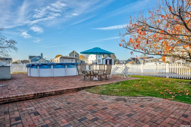 view of patio / terrace featuring a covered pool