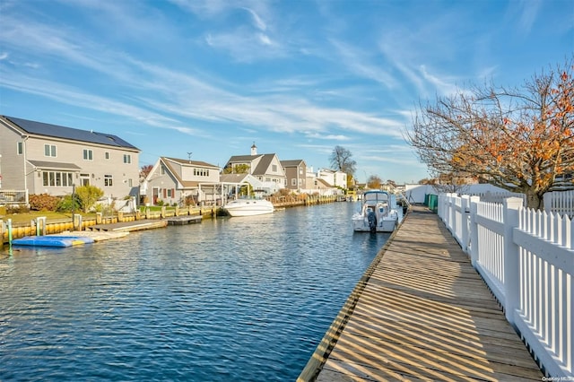 dock area with a water view