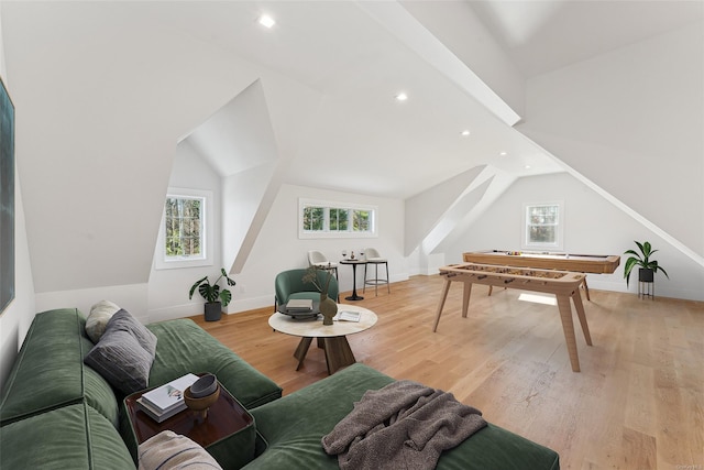 interior space featuring vaulted ceiling and light wood-type flooring