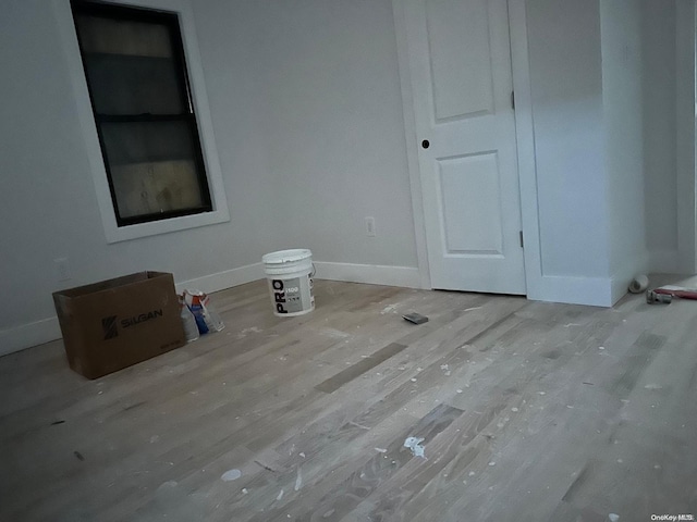 spare room featuring hardwood / wood-style flooring