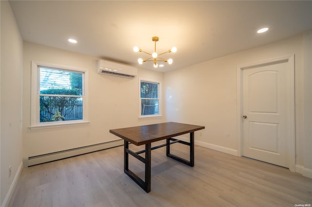 office space with light hardwood / wood-style flooring, a wall mounted AC, a baseboard heating unit, and a notable chandelier