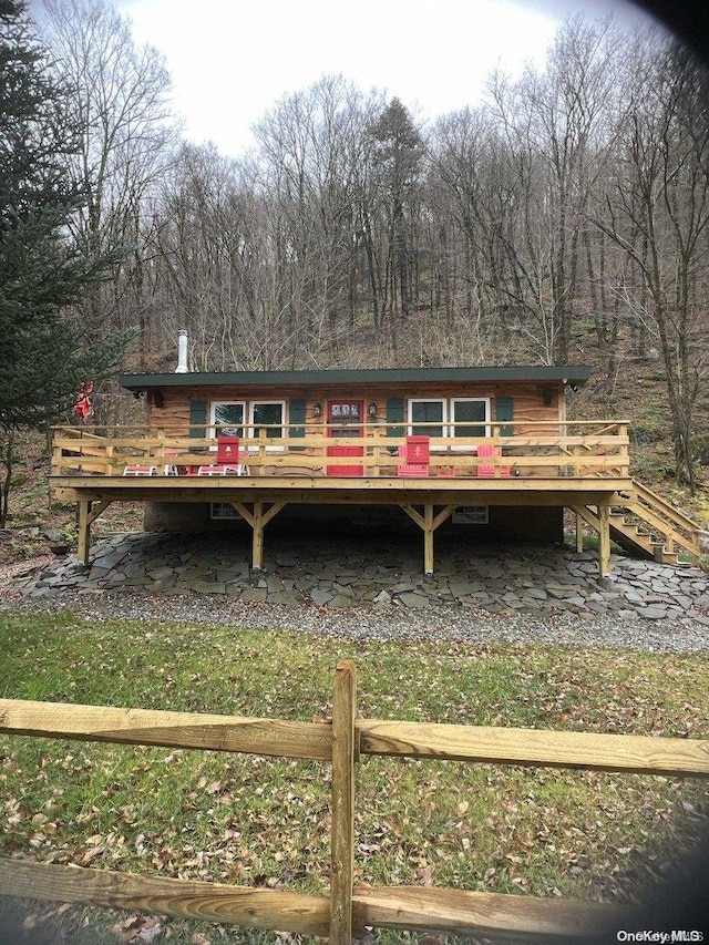 view of front of property with a wooden deck