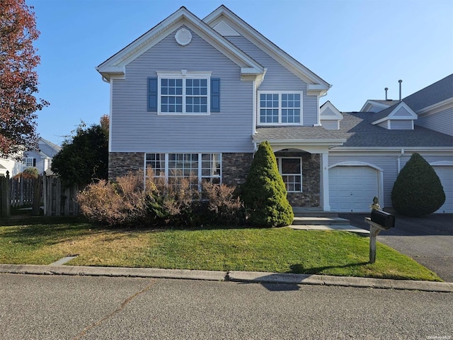 front facade with a garage and a front yard