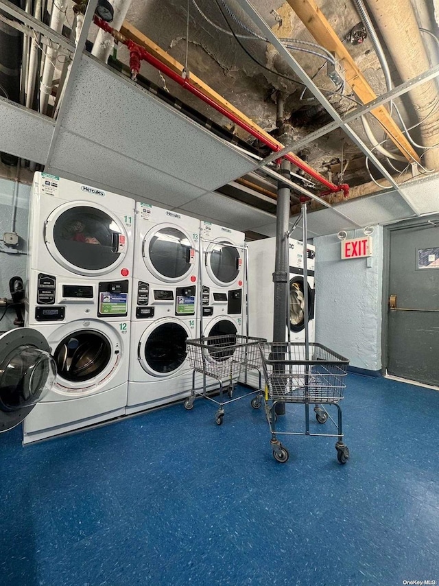 laundry area with stacked washer / dryer