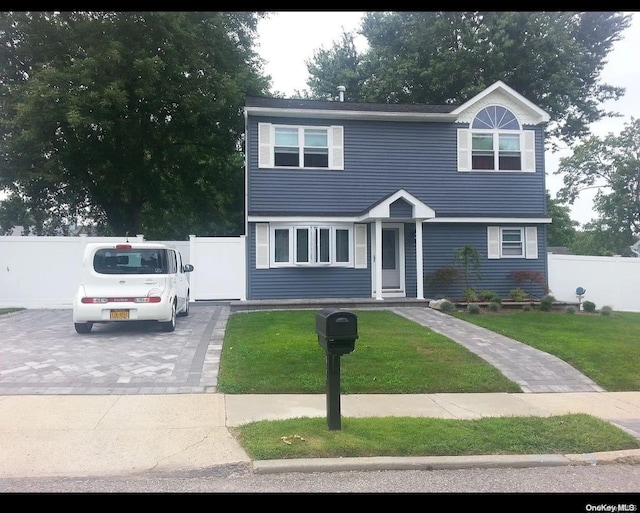 view of front facade with a front yard