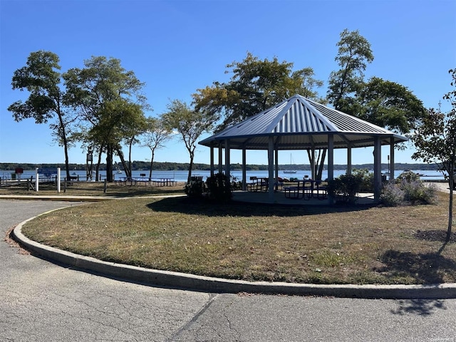 view of community with a gazebo and a water view