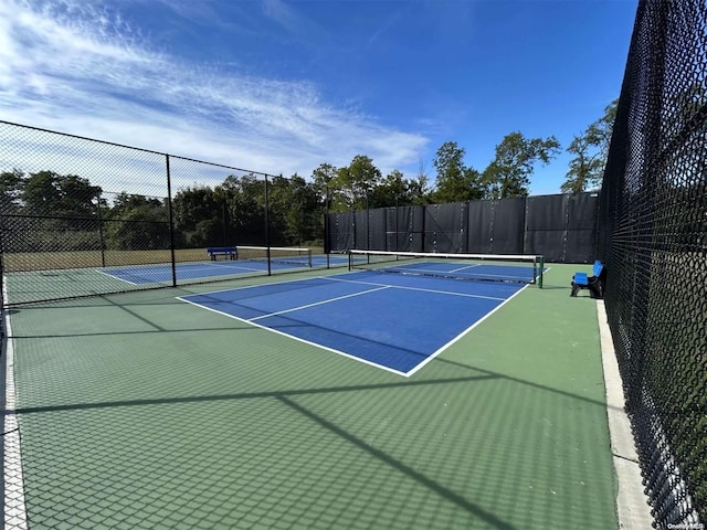 view of sport court featuring basketball hoop