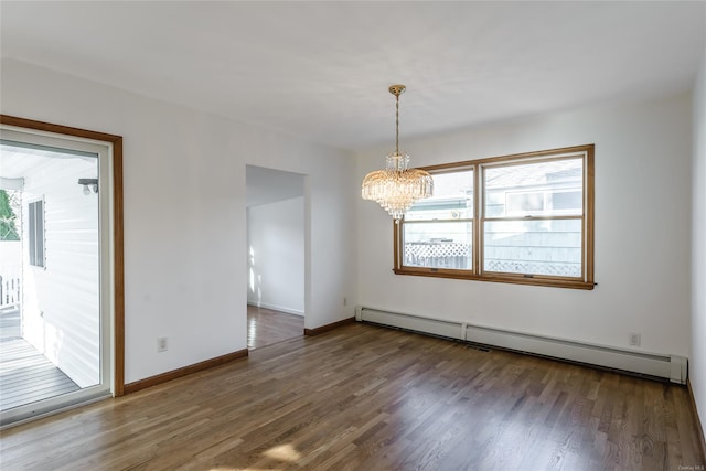 interior space with baseboard heating, plenty of natural light, dark hardwood / wood-style floors, and a notable chandelier