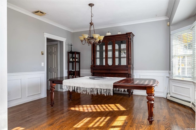 dining area featuring a chandelier, dark hardwood / wood-style flooring, and ornamental molding