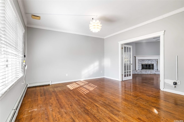 unfurnished living room featuring a fireplace, dark hardwood / wood-style flooring, crown molding, and a baseboard heating unit