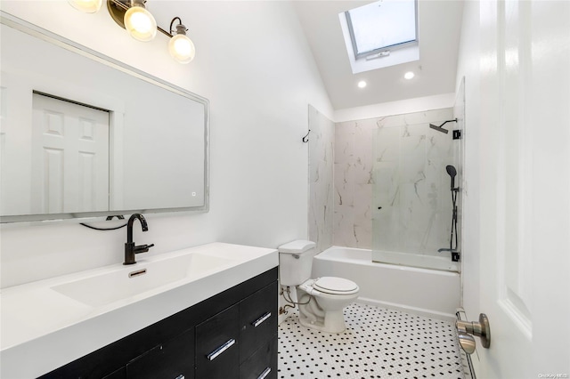 full bathroom featuring vaulted ceiling with skylight, vanity, tiled shower / bath combo, and toilet