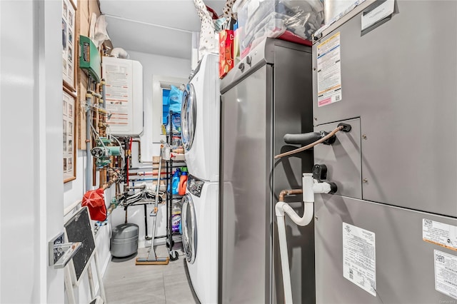 80 Illinois Ave, Long Beach, NY 11561 - utilities with stacked washing machine and dryer, heating unit, and tankless water heater