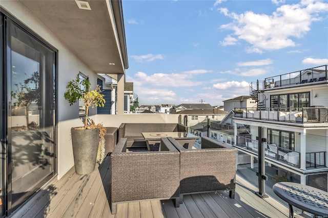 wooden deck with an outdoor hangout area