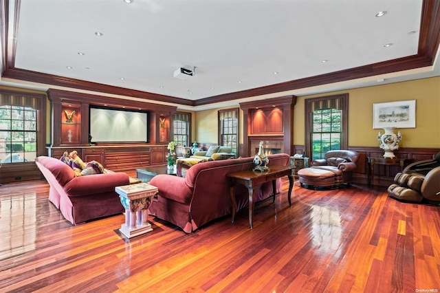 living room featuring wood-type flooring and ornamental molding