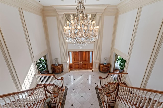 660 Chicken Valley Rd, Matinecock, NY 11560 - entryway featuring tile patterned flooring, a chandelier, and a towering ceiling