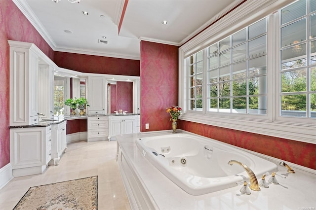 bathroom with tile patterned flooring, vanity, a bath, and ornamental molding