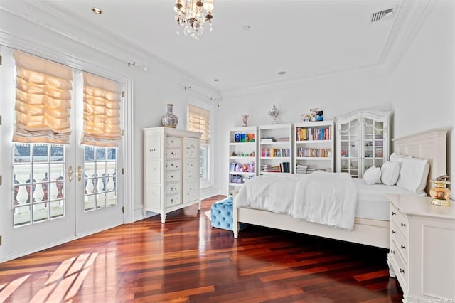 bedroom featuring hardwood / wood-style floors, french doors, crown molding, access to exterior, and a notable chandelier