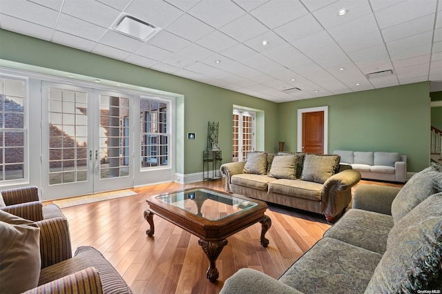 living room featuring french doors and hardwood / wood-style flooring