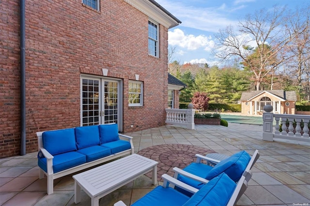 view of patio / terrace with an outdoor living space and an outdoor structure