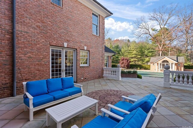 660 Chicken Valley Rd, Matinecock, NY 11560 - view of patio / terrace featuring an outdoor hangout area, an outdoor structure, a storage structure, and a pool