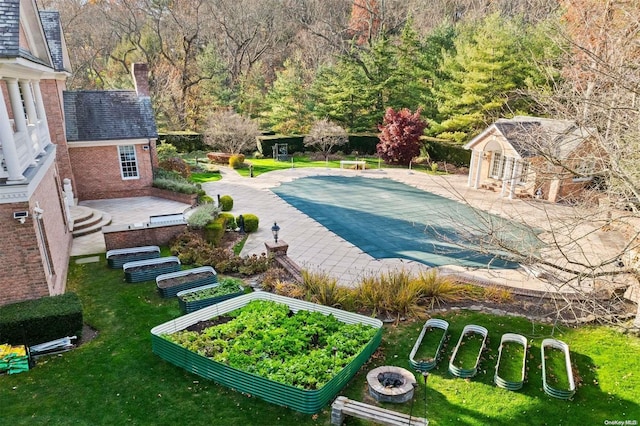 660 Chicken Valley Rd, Matinecock, NY 11560 - view of pool featuring a covered pool, an outbuilding, a patio, and a yard