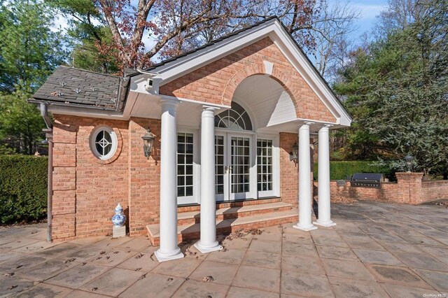 660 Chicken Valley Rd, Matinecock, NY 11560 - view of outbuilding with entry steps, area for grilling, and french doors