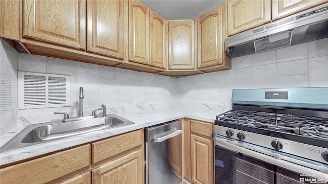 kitchen with light brown cabinets, backsplash, sink, appliances with stainless steel finishes, and extractor fan