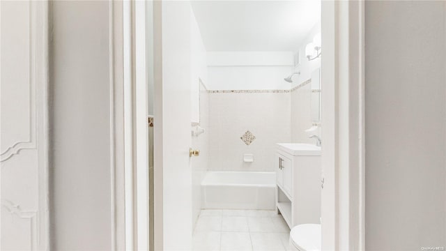 full bathroom with tile patterned flooring, vanity, toilet, and tiled shower / bath