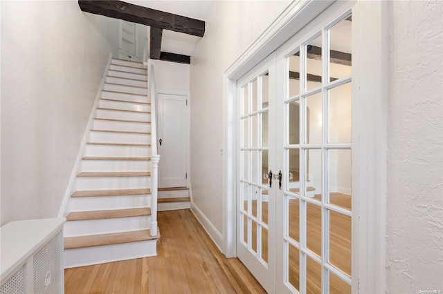 stairway with wood-type flooring