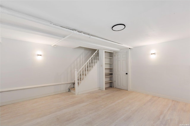 basement featuring light wood-type flooring