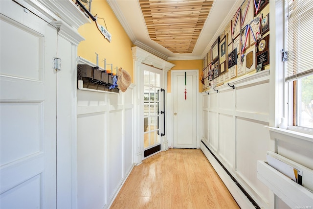 entryway with wood ceiling, light wood-type flooring, crown molding, and baseboard heating