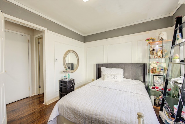 bedroom featuring dark hardwood / wood-style floors and ornamental molding