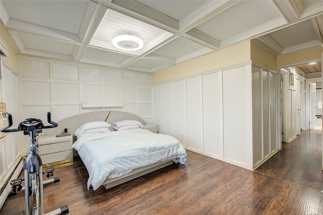 bedroom featuring beam ceiling, dark hardwood / wood-style floors, ornamental molding, and coffered ceiling