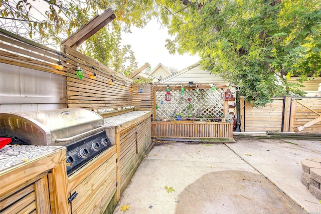 view of patio featuring a grill