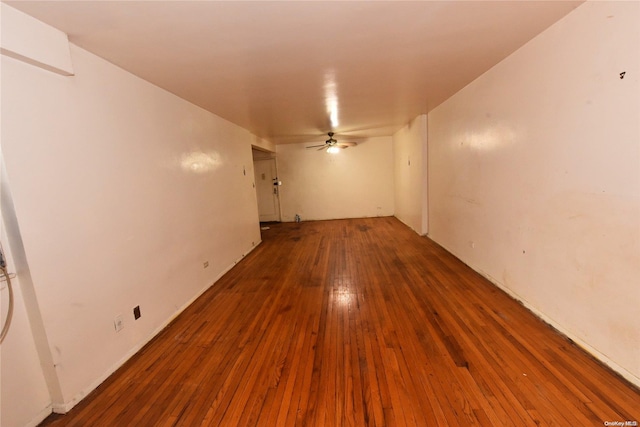 empty room featuring ceiling fan and wood-type flooring