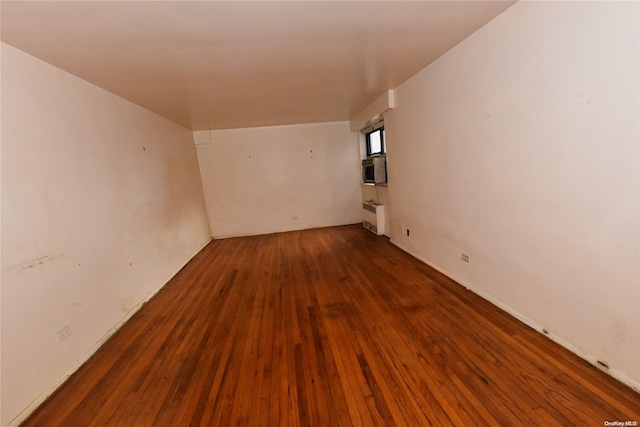 unfurnished room featuring dark hardwood / wood-style floors