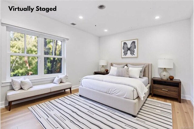 79 Farmview Rd, Port Washington, NY 11050 - bedroom with light wood-type flooring and recessed lighting