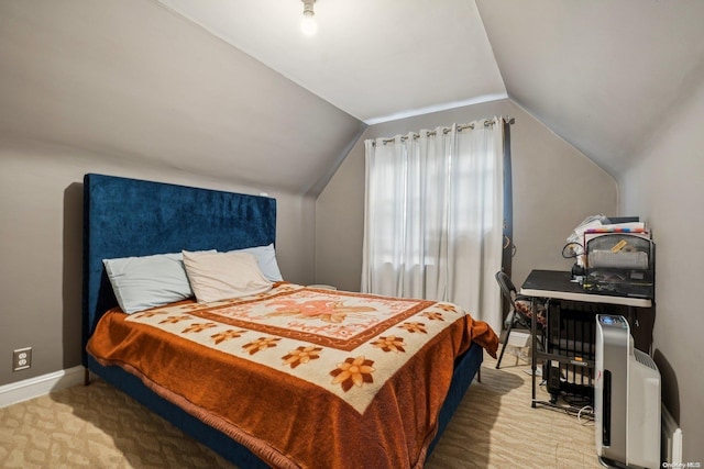 bedroom featuring carpet flooring and vaulted ceiling