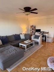 living room featuring parquet floors