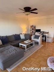 18-05 215th St Unit 16S, Bayside, NY 11360 - living room with a ceiling fan