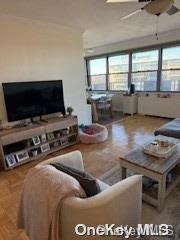 18-05 215th St Unit 16S, Bayside, NY 11360 - living area featuring ceiling fan