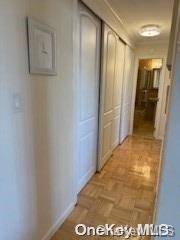 18-05 215th St Unit 16S, Bayside, NY 11360 - hall featuring baseboards