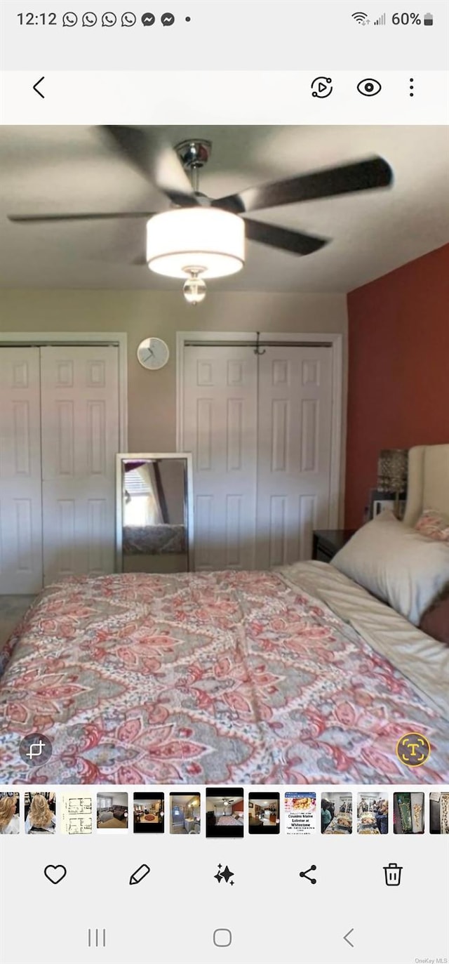 unfurnished bedroom with ceiling fan and a closet