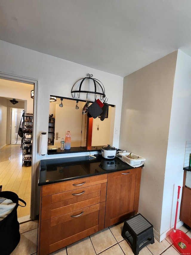 kitchen with light tile patterned flooring